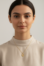 Load image into Gallery viewer, gold hamsa outline on a model