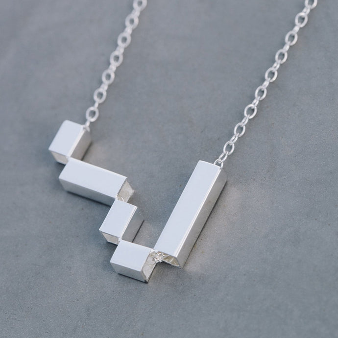Asymmetric tetris necklace
