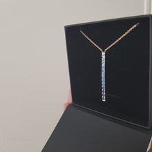Load and play video in Gallery viewer, rainbow of ombre hues from dark to light sapphires bar pendant
