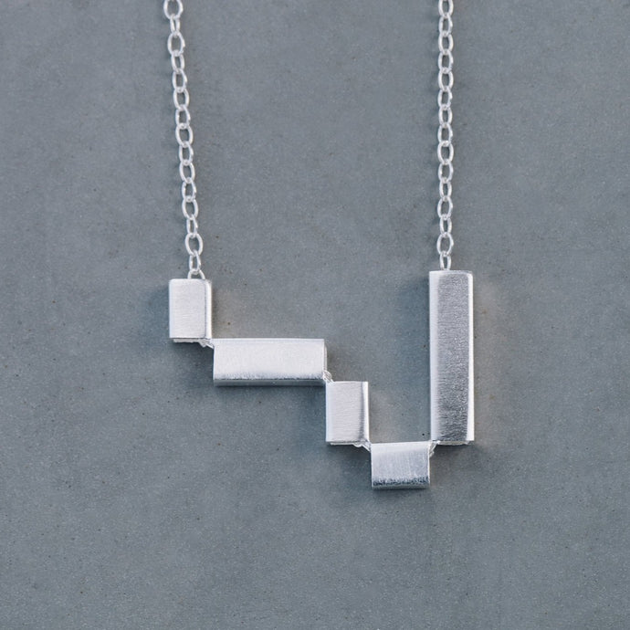 Asymmetric tetris necklace
